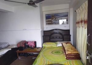 En eller flere senge i et værelse på Double lake view homestay