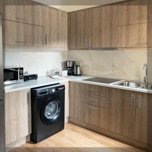 Nhà bếp/bếp nhỏ tại Favelas Luxury Apartments