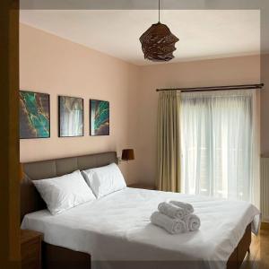 Giường trong phòng chung tại Favelas Luxury Apartments +42 ảnh