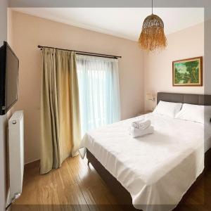 Giường trong phòng chung tại Favelas Luxury Apartments