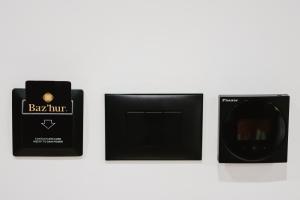 a group of three boxes of soap on a wall at BAZ'HUR Boutique Hotel in Kukës