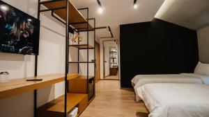 a bedroom with a bed and a book shelf at BAZ'HUR Boutique Hotel in Kukës