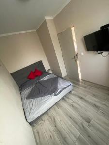 Posteľ alebo postele v izbe v ubytovaní Renáta Apartman