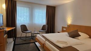 Postel nebo postele na pokoji v ubytování Elha Hotel