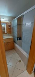 a bathroom with a shower and a sink at Amdar Village Cottage עם ממ"ד in Eilat +11 photos