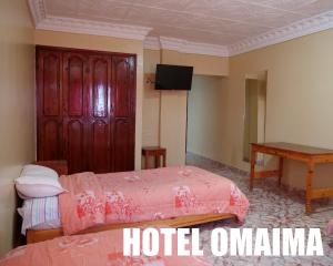 Postel nebo postele na pokoji v ubytování Hotel OMAIMA