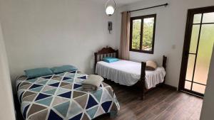 Кровать или кровати в номере Cabaña Vista Verde