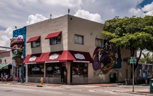 a building on the corner of a street at B6 Best Value on Private Bedroom with Private Bathroom in Little Havana, Miami in Miami