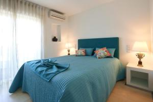 Postel nebo postele na pokoji v ubytování Host In Olivença + 17 fotografií