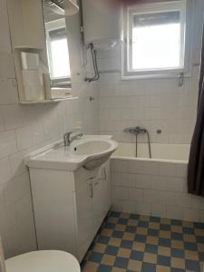a bathroom with a sink and a tub and a toilet at Istanbul apartment 3 in Belgrade +13 photos
