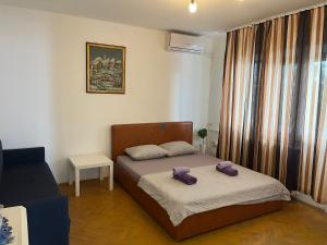 a bedroom with a bed with two pillows on it at Istanbul apartment 3 in Belgrade