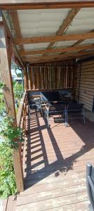 Balkoni atau teres di Chalet Cozy Cove te Lauwersoog,1-6 Pers, 3 Schlafzimmer, 2 Badezimmer, 55m2!
