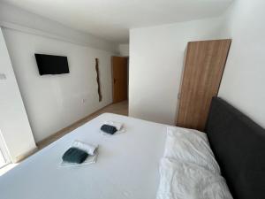Apartmani Jukanovic tesisinde bir odada yatak veya yataklar