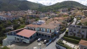 an aerial view of a city with buildings and mountains at Hotel Villa Principe in San Nicola Arcella