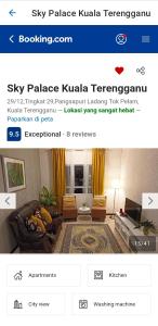 a webpage of a living room with a couch and yellow curtains at Sky Palace Kuala Terengganu in Kuala Terengganu