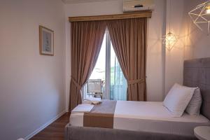 Postel nebo postele na pokoji v ubytování Hotel Murati