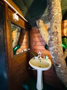 a bathroom with a sink in a tree house at Animal View Point Yala in Tissamaharama