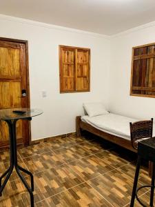 Giường trong phòng chung tại Chale Surf Natureza e Charme em Corumbau