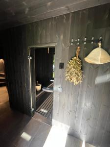 a view of a room with a wooden wall at Kur skamba varpai in Berżory