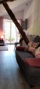 a living room with a couch and a large window at A Larriou in Mirepoix +12 photos