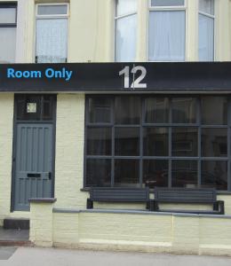 a building with a sign that reads room only at No12 Guesthouse South Shore Blackpool in Blackpool