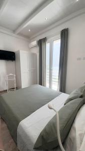 Postel nebo postele na pokoji v ubytování Casa Virgilio