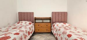 Letto o letti in una camera di Corazón Urbano