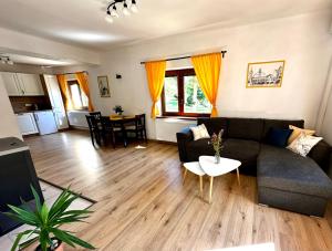 a living room with a couch and a table at Domek U Labe in Stanovice