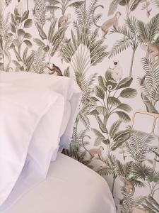 a bedroom with a wallpaper with birds and plants at Villa Matisse Luxury Beach in Torremolinos +15 photos
