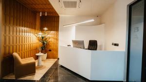 an office with a desk and a laptop on a counter at BAZ'HUR Boutique Hotel in Kukës
