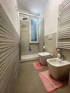 a bathroom with a shower and a sink and a toilet at Appartamento Sea La Vie in Genova