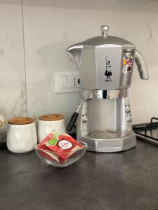 a kitchen counter with a mixer and a bowl of food at Appartamento Sea La Vie in Genova