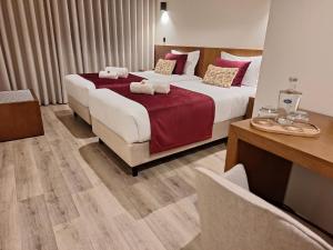 Postel nebo postele na pokoji v ubytování 3M Hostel & Suites