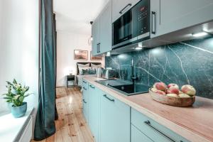 The Malmöer, modern 1 BR on 40m2, own backyard garden-terrace, quite & relaxed, however central in Prenzlauer Berg 주방 또는 간이 주방