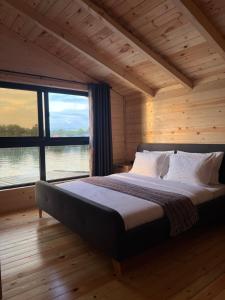 Postel nebo postele na pokoji v ubytování Bonita Cottage Ada Bojana