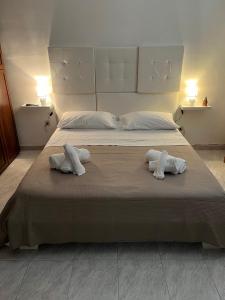 Ένα ή περισσότερα κρεβάτια σε δωμάτιο στο La perla del mare Milazzo