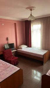 A bed or beds in a room at S OTEL SİVAS