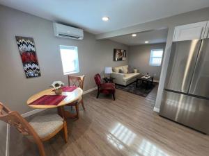 a kitchen and living room with a table and a refrigerator at Calm and relaxing 1 bed in Brighton