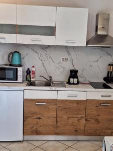 Kuchyň nebo kuchyňský kout v ubytování Studio I