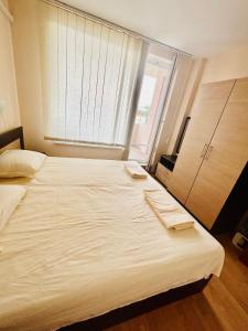 a large white bed in a room with a window at Paradise View in Sunny Beach +39 photos