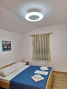 Posteľ alebo postele v izbe v ubytovaní Apartmani MW, Plavi apartman