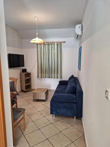 Televízia a/alebo spoločenská miestnosť v ubytovaní Apartmani MW, Plavi apartman