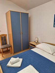 Posteľ alebo postele v izbe v ubytovaní Apartmani MW, Plavi apartman