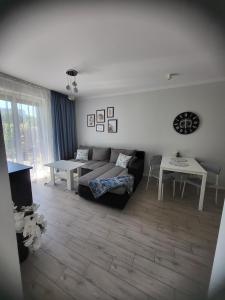 Posteľ alebo postele v izbe v ubytovaní Apartamenty Olimpijska