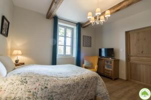 Letto o letti in una camera di Maison d'hôtes "La Clef des Champs" Piscine Ortance