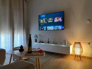 A television and/or entertainment centre at West Comfort - near Agia Marina metro