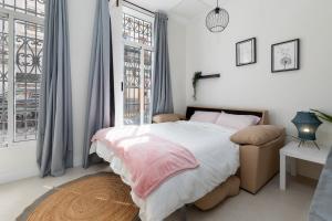 Ένα ή περισσότερα κρεβάτια σε δωμάτιο στο Apartamento Ruzafa 1 habitacion y 2 sofas cama