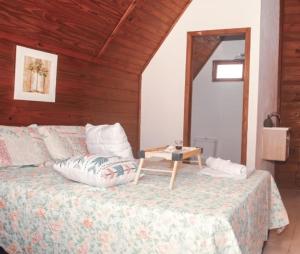 Säng eller sängar i ett rum på Pousada Cabanas