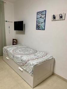 Postel nebo postele na pokoji v ubytování Vitti Apartment