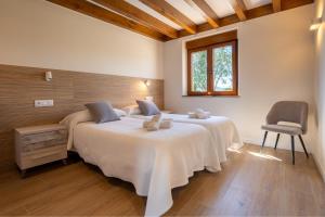Postel nebo postele na pokoji v ubytování Apartamentos Rurales Quintanilla